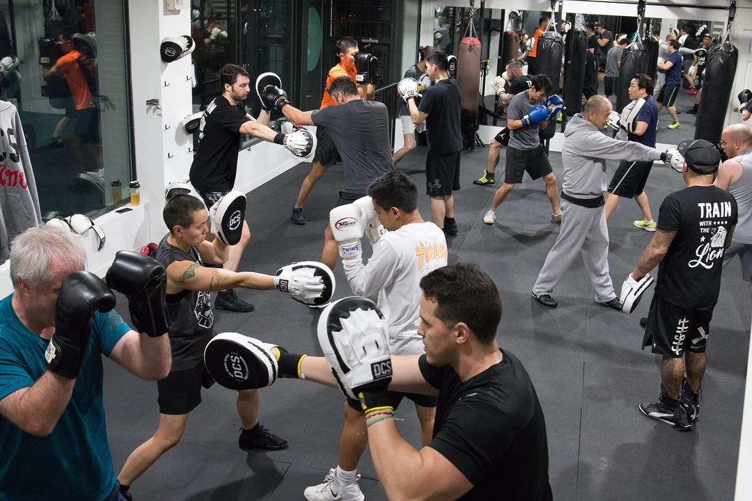 Pad work at boxing Vancouver classes